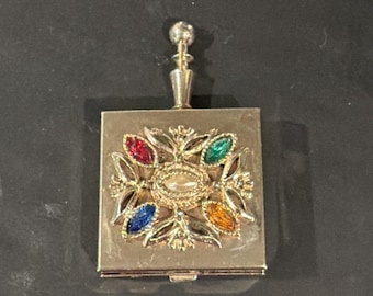 Cinzeiro portátil de bolso vintage Silent Butler com porta-comprimidos e strass multicoloridos.