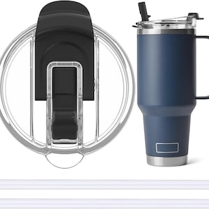 May include: A navy blue insulated tumbler with a handle, a clear lid, and a black lid. Two clear straws are also included. The tumbler has a stainless steel base and a small rectangular logo.