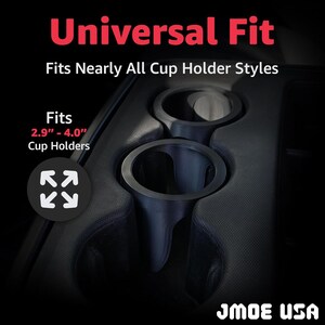 May include: Black car cup holder with the text "Universal Fit" and "Fits Nearly All Cup Holder Styles". The cup holder fits 7.4 cm - 10.2 cm cup holders. The brand name "JMOE USA" is visible at the bottom.