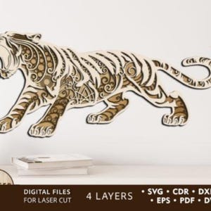 May include: A multi-layered wooden tiger cutout with intricate patterns and open mouth. The tiger is in a walking pose, with a light brown and beige color scheme. The image includes the text "DIGITAL FILES FOR LASER CUT" and "4 LAYERS".