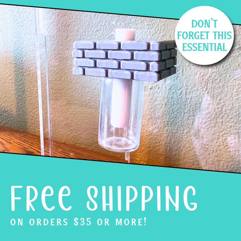 May include: A clear glass cylindrical container topped with a rectangular, light purple, brick-patterned block. The object features a central vertical pillar extending through the center of the brick structure into the glass vessel below.