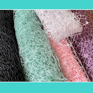May include: A collection of rolls of decorative mesh fabric featuring an open, web-like structure. The rolls are displayed in a variety of colors including black, mint green, white, soft pink, and a deep purple, all with a consistent texture.