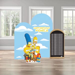 May include: A blue backdrop with the Simpsons family and the text "Happy Birthday Monica". A wooden framed chalkboard is to the right. The backdrop is in front of a light blue sky with white clouds.