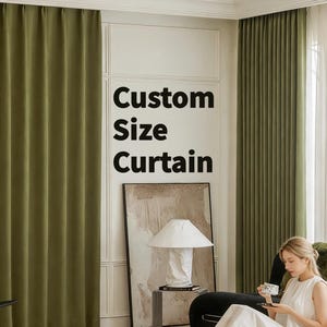 May include: Olive green custom size curtains hanging in a room. The curtains are floor-length and made of a thick, textured fabric. The text "Custom Size Curtain" is displayed on the wall. A woman is sitting in a chair, holding a cup.