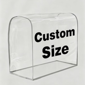 May include: A clear, transparent protective cover with a rounded top and rectangular base. The front surface features the bold, black text "Custom Size" printed in a sans-serif font. The cover is constructed from a smooth, flexible material.