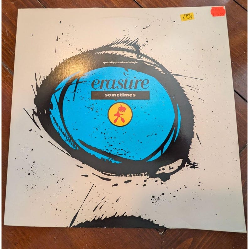 Puede incluir: Vinilo de Erasure "Sometimes". La portada presenta un dise&ntilde;o abstracto azul y negro con el nombre de la banda y el t&iacute;tulo de la canci&oacute;n. Es un maxi-single a precio especial.