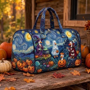 May include: A holdall bag featuring a dark blue, swirling night sky print with illustrations of ducks dressed as a witch, a ghost, and a vampire. The bag includes two top handles, a zip closure, and a pattern of jack-o'-lanterns and a castle.