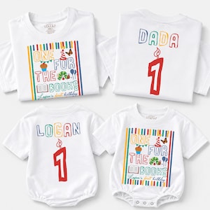 May include: Two white short-sleeved t-shirts and two white short-sleeved onesies. The shirts and onesies feature a colorful graphic with the text "ONE FOR THE BOOKS" and "Logan's first birthday," plus a "DADA" or "LOGAN" shirt with a red number 1.