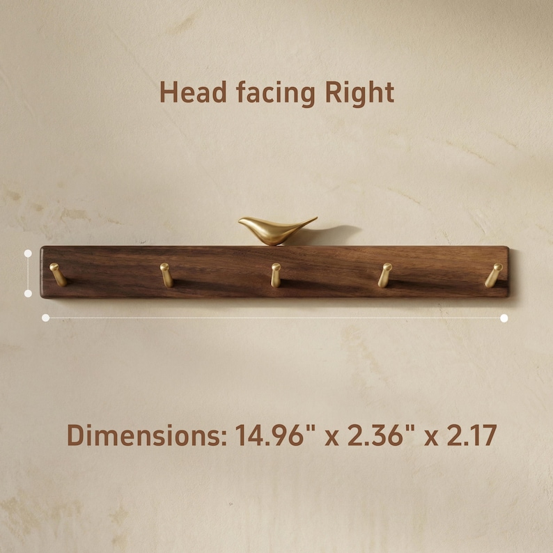 May include: A wooden wall-mounted coat rack with six brass hooks and a decorative brass bird. The rack is 14.96 inches long, 2.36 inches wide, and 2.17 inches high. The text "Head facing Right" and "Dimensions: 14.96" x 2.36" x 2.17" are visible.