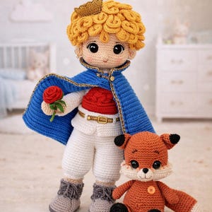 May include: Crocheted doll of a young prince with a golden crown, blue cape, and red shirt, holding a red rose. A crocheted fox doll is also present. The dolls are handmade and suitable for children.