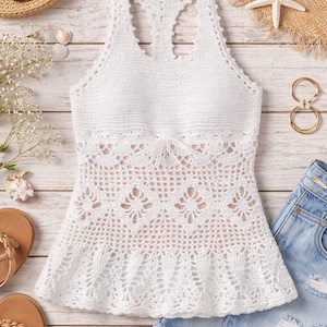 May include: White crochet top with a halter neckline and openwork design. The top is paired with denim shorts, sandals, and a straw hat, suggesting a beach or summer theme. Other accessories include sunglasses, seashells, and gold hoop earrings.