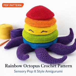 Könnte beinhalten: Ein farbenfroher Häkel-Oktopus in Regenbogenfarben, mit dem Text "PDF PATTERN" oben links. Der Oktopus hat einen Stapel von Ringen in Regenbogenfarben für den Kopf und lila Tentakeln. Der Text "Rainbow Octopus Crochet Pattern" und "Sensory Pop It Style Amigurumi" stehen unten.