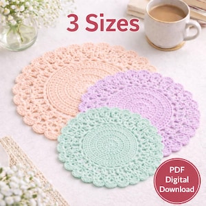 May include: Three crocheted doilies in peach, lavender, and mint green. The doilies are circular with a scalloped edge and a detailed, openwork design. The text "3 Sizes" is above the doilies, and a "PDF Digital Download" badge is in the lower right corner.
