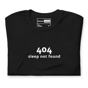 May include: A set of three ceramic mugs with a speckled, matte finish in cream, light grey, and dark grey. Each mug has a simple, modern design and a rounded handle. Ideal for tea or coffee.