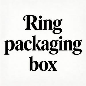 May include: White background with the words "Ring packaging box" in bold, black font. The text is centered and takes up most of the image, suggesting a product label or packaging design.