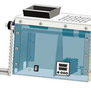 May include: A rectangular, silver machine with a transparent blue interior. It has a black top tray, a digital display, and a clear, cylindrical handle. The machine is secured with multiple screws.