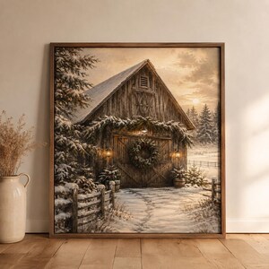 May include: A framed wall art print depicting a rustic wooden barn in a snowy winter landscape. The barn features a large wreath on the double doors, snow-covered pine trees, and a fence in the foreground under a soft, golden sunset sky.