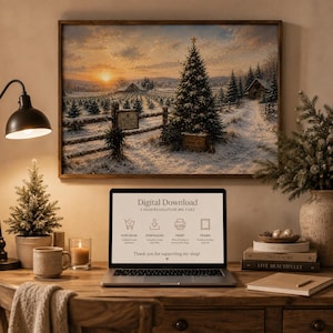 May include: A framed landscape print of a snowy Christmas tree farm at sunset hangs above a laptop displaying digital download instructions. The screen shows icons for purchase, download, print, and frame, with text reading Digital Download.