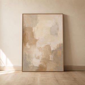 May include: A rectangular wall art piece featuring an abstract painting with thick, visible brushstrokes in a neutral color palette of beige, cream, tan, and soft gray tones, enclosed within a thin, light-colored wooden frame.