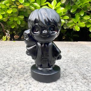 May include: A set of three ceramic mugs with a speckled, matte finish. The mugs are in shades of cream, light grey, and dark grey. Each mug has a simple, minimalist design, ideal for coffee or tea.