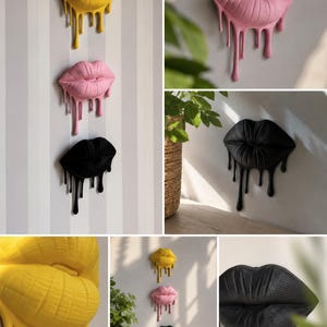 Pode incluir: Arte de parede com lábios estilizados com efeito de tinta escorrendo. Os lábios são amarelos, rosa e pretos, montados em uma parede listrada. O efeito de tinta escorrendo adiciona um toque artístico único à decoração.