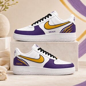 Nike White Sneakers with Yellow and Purple Swoosh Accents The Kobe Bryant x Nike Air Force 1 Low unites the legacy of  main image 4