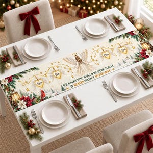 May include: A rectangular table runner featuring a cream background with a central angel illustration, hanging heart ornaments labeled Luna, Ben, Chloe, and Louis, and the text We know you would be here today if heaven wasn't so far away.