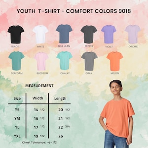May include: A display of youth t-shirts in various colors, including black, white, blue jean, pepper, violet, orchid, seafoam, blossom, chalky, gray, and melon. The image also shows a size chart with measurements in inches and a young person wearing a melon-colored t-shirt.