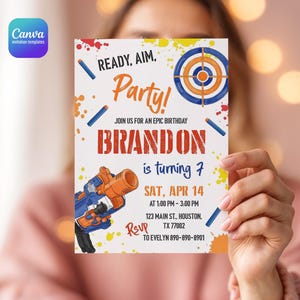 May include: A rectangular birthday invitation card featuring a blue and orange toy blaster, a target, and colorful paint splatters. The text reads: READY, AIM, Party! JOIN US FOR AN EPIC BIRTHDAY BRANDON is turning 7 SAT, APR 14 AT 1:00 PM - 3:00 PM 123 MAIN ST., HOUSTON, TX 77002 RSVP TO EVELYN 890-890-8901.