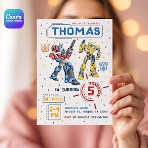 May include: A white invitation card featuring illustrations of Transformers characters Optimus Prime and Bumblebee. The card includes the name "THOMAS", the number "5", and event details: date, time, and location.