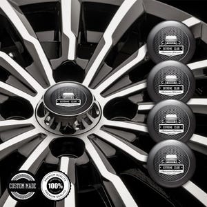 May include: A car wheel with a black and silver spoke design. The wheel features a central cap with the text "EXTREME CLUB" and a logo. Several additional caps are shown. Two circular stickers with text are also visible.