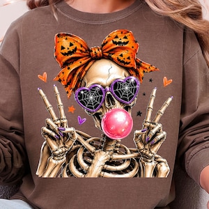 spooky skeleton woman wearing jack o lantern bow and web sunglasses