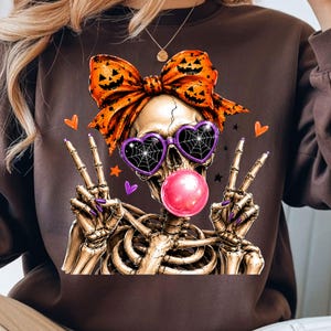halloween skull girl with pumpkin bow and colorful spooky accents