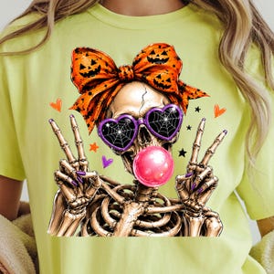 halloween skeleton with bubble gum and heart shaped spider web sunglasses
