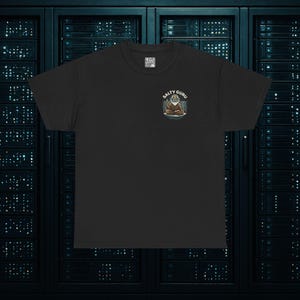 May include: Black t-shirt with a small graphic of a meditating guru with the text "SALTY GURU" above the graphic. The guru is depicted with a long white beard and is wearing a brown robe. The t-shirt is made of a soft material.