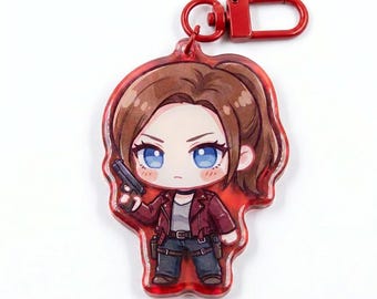 May include: An acrylic keychain featuring a chibi-style character with brown hair in a ponytail, blue eyes, and a red jacket. The character holds a black handgun and wears dark pants with a belt. The keychain includes a red metal lobster clasp.
