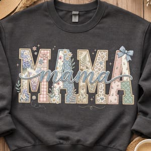 May include: A set of three ceramic mugs with a speckled, cream-colored glaze. Each mug features a different hand-painted floral design in shades of blue, green, and yellow. The mugs have a simple, rounded shape and a comfortable handle.