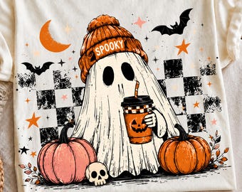 May include: A cream-colored t-shirt featuring a graphic of a ghost wearing an orange beanie with the word SPOOKY, holding a pumpkin-themed coffee cup. The design includes black and white checkered patterns, bats, stars, and two pumpkins.