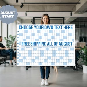 May include: A large rectangular wall calendar featuring a grid layout with blue and white columns. The text CHOOSE YOUR OWN TEXT HERE is printed at the top, and FREE SHIPPING ALL OF AUGUST is centered. The months July through June are listed on the left.