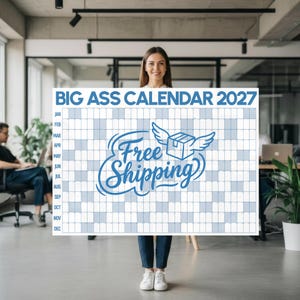 May include: A large rectangular 2027 wall calendar with a white background and blue grid. The top text reads BIG ASS CALENDAR 2027. The centre features a blue graphic of a box with wings and the script text Free Shipping.