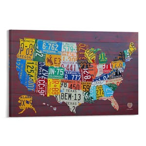 May include: A wooden wall art piece featuring a map of the United States, constructed from various license plates. The license plates are in different colors and designs, creating a vibrant and unique collage. The background is a dark, reddish-brown wood.