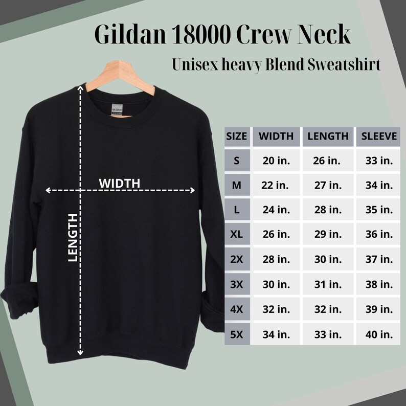 May include: Black Gildan 18000 Crew Neck Unisex heavy Blend Sweatshirt hanging on a wooden hanger. The image includes a size chart with measurements in inches for width, length, and sleeve length, ranging from size S to 5X.