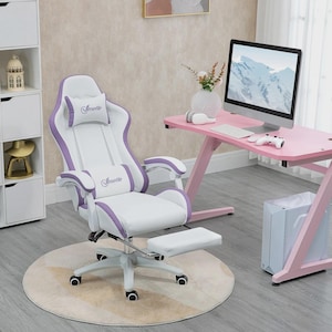 May include: A white and purple gaming chair with a footrest. The chair features a high back, armrests, and a headrest with the word "Josetto". The chair sits on a round beige rug. A pink desk and computer are in the background.