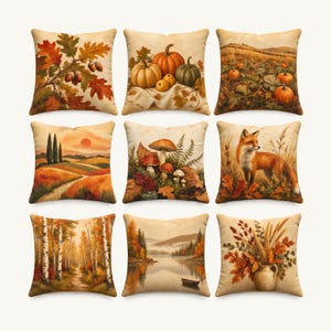 May include: A set of nine square throw pillows featuring autumn-themed illustrations including oak leaves with acorns, pumpkins, a pumpkin patch, a sunset landscape, mushrooms, a fox, a birch forest, a misty lake with a boat, and a floral vase.