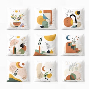 May include: A white ceramic mug with a black handle and the text "But First, Coffee" in a bold, black font. The mug is set against a neutral background, highlighting its simple design.