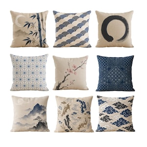 May include: Nine square throw cushions with diverse Japanese-inspired designs. Cushions feature bamboo, waves, a black circle, geometric patterns, cherry blossoms, koi fish, clouds, and mountain landscapes. The colour palette includes beige, blue, and black.