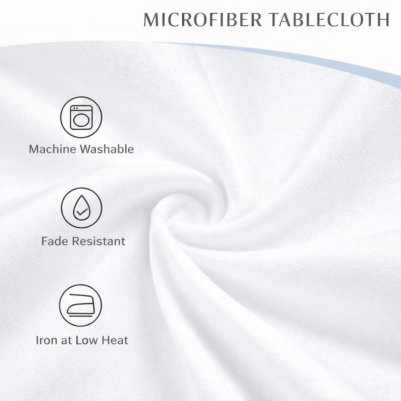 May include: Close-up of a white microfiber tablecloth, with the text "MICROFIBER TABLECLOTH". The image highlights the fabric's texture and features icons and text indicating it's machine washable, fade-resistant, and ironable at low heat.
