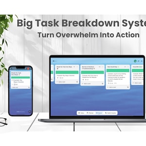 May include: A laptop and smartphone displaying a task management system with the text "Big Task Breakdown System" and "Turn Overwhelm Into Action." The screens show a blue background with task cards. A pair of glasses rests on the table.