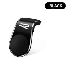 以下が含まれることがあります： 磁気ベースを備えた黒い車の電話マウント。マウントは、シルバーのトリムと円形の磁気領域を備えた湾曲したデザインです。「BLACK」という単語がマウントの上にある黒い長方形に表示されます。