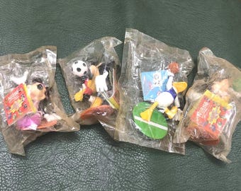 Four 90's Nestlé Disney Sport figures: Donald Duck, Mickey Mouse, and Minnie Mouse.